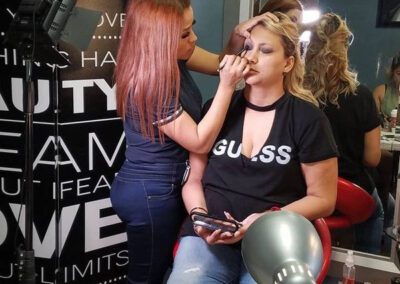 Women Appplying Eyeliner